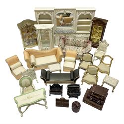 Collection of miniature dolls house furniture, to include mirrored fireplace unit with bookcases and cupboards to either side, painted white with gilt detail and yellow flowers, three piece peach chaise lounge and chair set, Knoll style sofa, display cabinets, footstools, suitcases, etc (25)