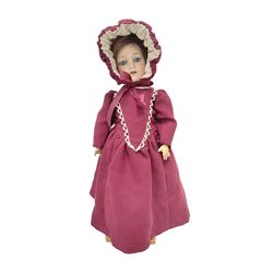 Armand Marseille bisque head doll with applied hair, sleeping eyes, open mouth with upper teeth and composition body with jointed limbs; marked ' Armand Marseille 390n, A2M, H46cm, with wooden stand