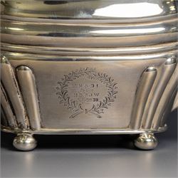 Edwardian silver teapot, of part fluted oval form upon four bun feet, with ebonised handle and finial and presentation engraving to body, hallmarked Thomas Bradbury & Sons, London 1904, H17cm