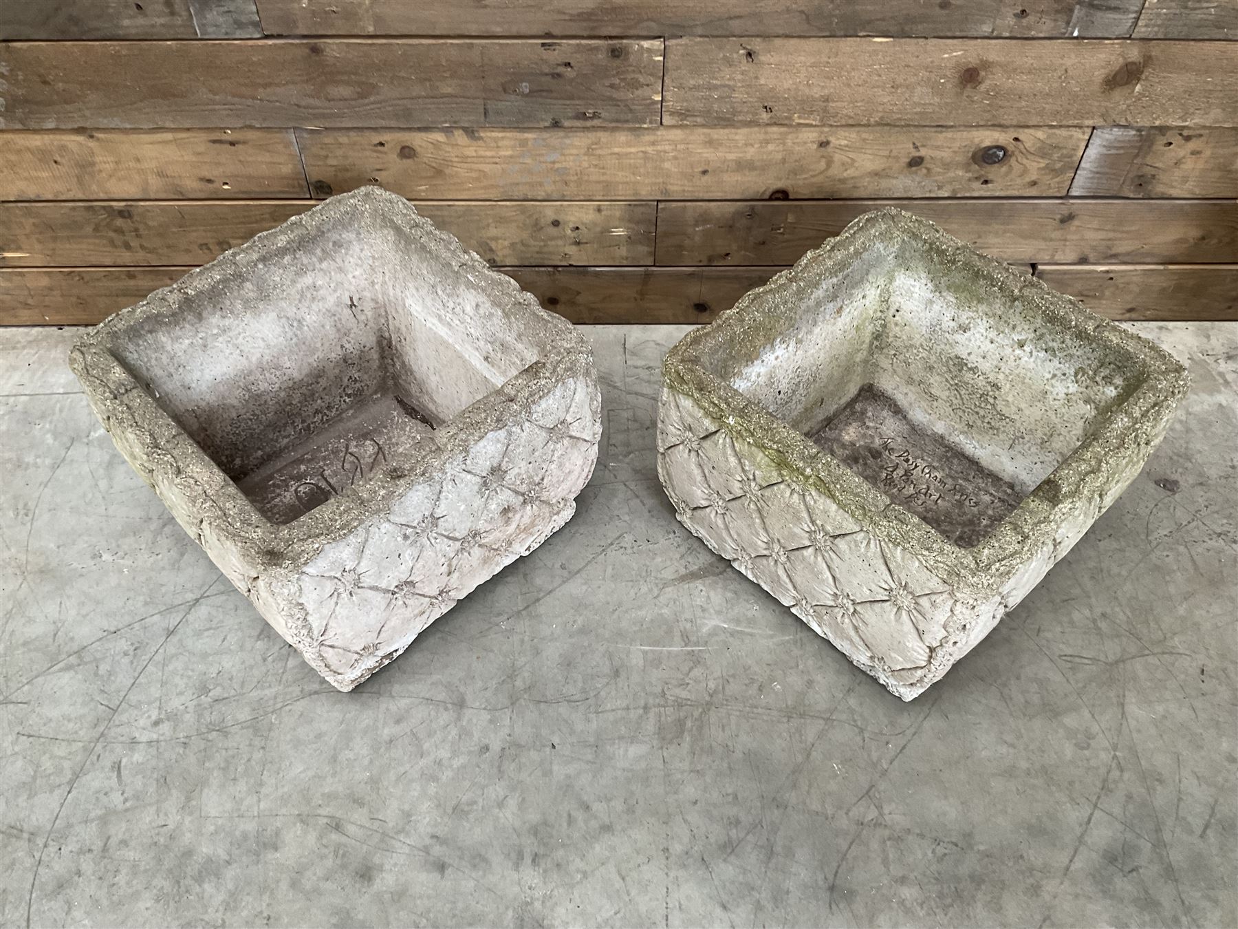 Pair of weathered cast stone square planters, daisy chain detail, one stamped