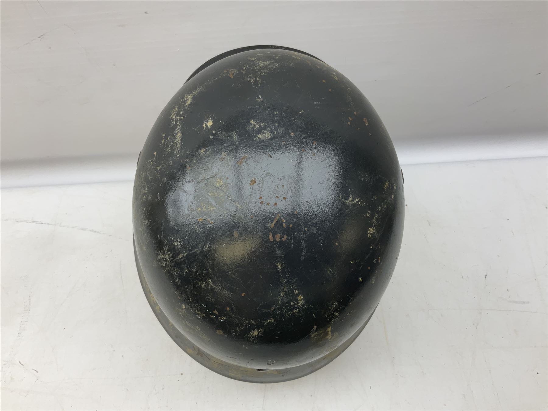 WW2 German steel helmet painted in undecaled Luftwaffe bluey grey with leather liner and chin strap stamped '58', the skirt impressed '1250'