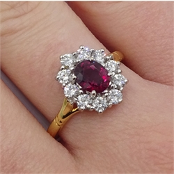  18ct gold oval ruby and round brilliant cut diamond cluster ring, hallmarked, ruby  1.07 carat  