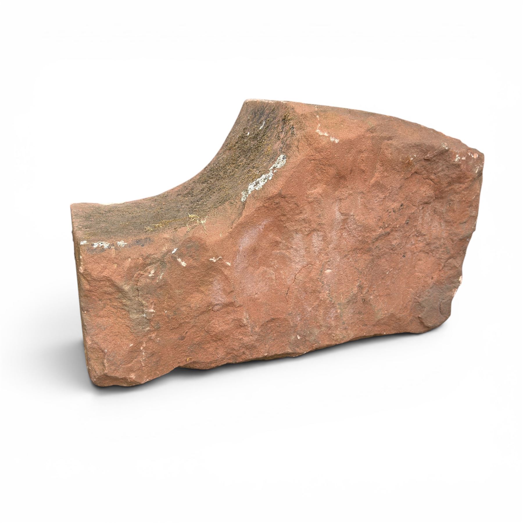 Pair of 19th century hewn and carved stone wall ends, the facias carved as shaped faux fielded panels