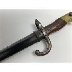 French Model 1874 epee/gras bayonet the 52cm steel piped back blade inscribed Paris Oudry 1879, in original scabbard, both numbered FH 57747, L66cm overall