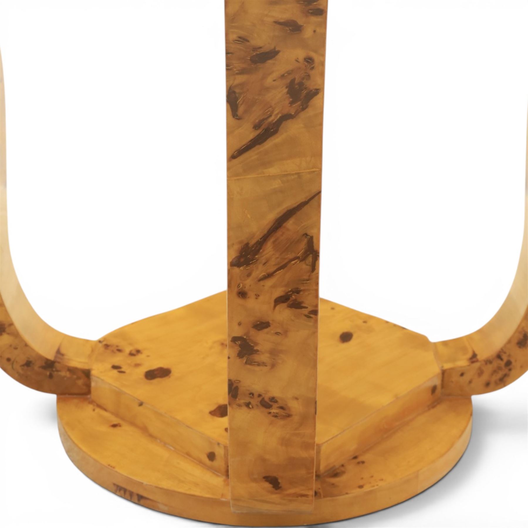 Art Deco style pair of burr walnut lamp tables, octagonal top with rounded corners and book-matched veneers, on four shaped supports united by a circular undertier and plinth base