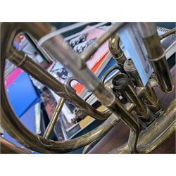 Boosey & Co Ltd French horn, converted into a table lamp, upon a wooden plinth, H45cm