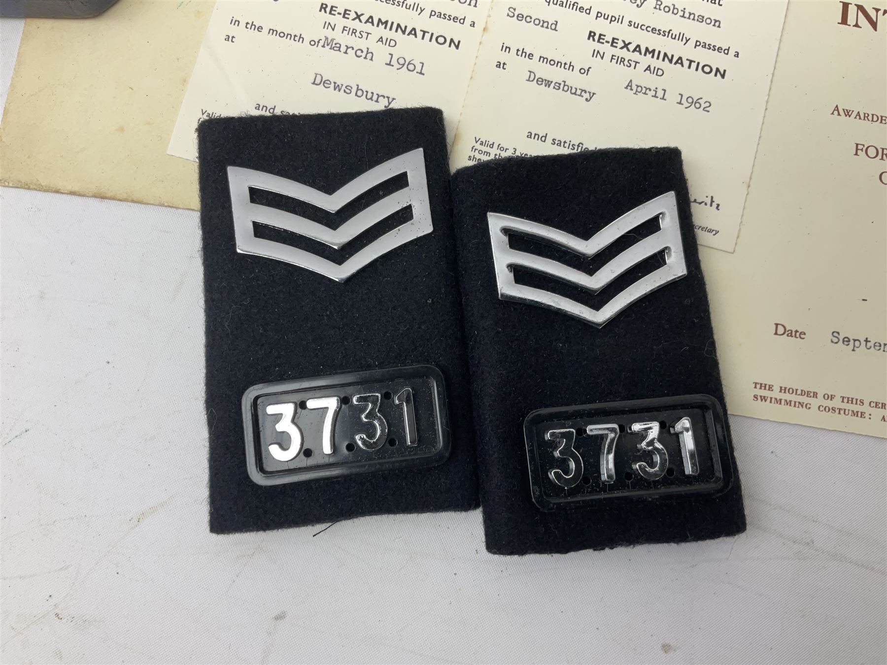 Archive of memorabilia and ephemera relating to Pc. (later Sgt.) Geoffrey Robinson of Dewsbury (later West Yorkshire) police force including cased Long Service and Good Conduct Medal; helmet plates and cap badges, collar numbers and uniform buttons, whistles, certificates, photographs, plaque etc 1960s - 1990s