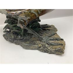 Large stoneware sculpture modeled as a Ring Neck Pheasant, upon a naturalistic base, H55cm, L78cm