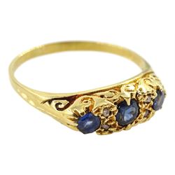 18ct gold three stone sapphire ring, with diamond accents set between