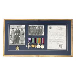 Warrant Officer Gordon Pearce D.F.C. R.A.F.V.R. - display of five medals comprising copy Distinguished Flying Cross, copy Air Crew Europe Star, 1939-45 Star, 1939-45 War Medal and Defence Medal; framed with RAF cap badge, two copy photographs in uniform and copy of investiture letter; mounted and glazed in pine frame 34 x 66cm