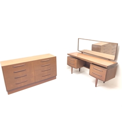  G-Plan teak chest, eight graduating drawers, plinth base (W142cm, H76cm, D45cm) and matching floating top dressing table, raised mirror back, one slide and four drawers, tapering supports (W153cm, H121cm, D50cm) (2)  