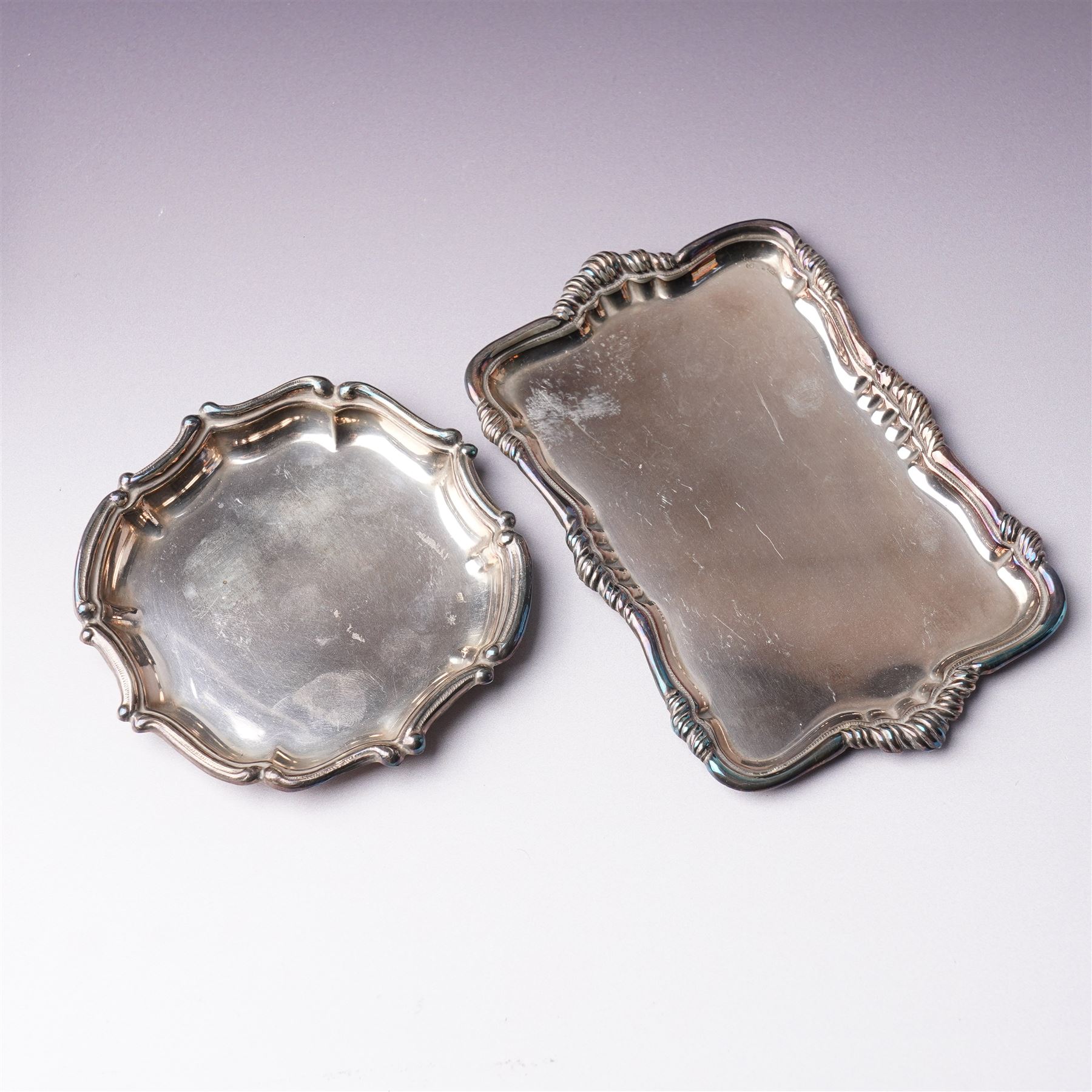 Pair of silver sauce boats with crimped rims Sheffield 1935 Maker Mappin & Webb, small embossed silver tray and two other small trays