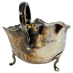 Silver sauce boat, hallmarked and a small silver christening mug, stamped sterling