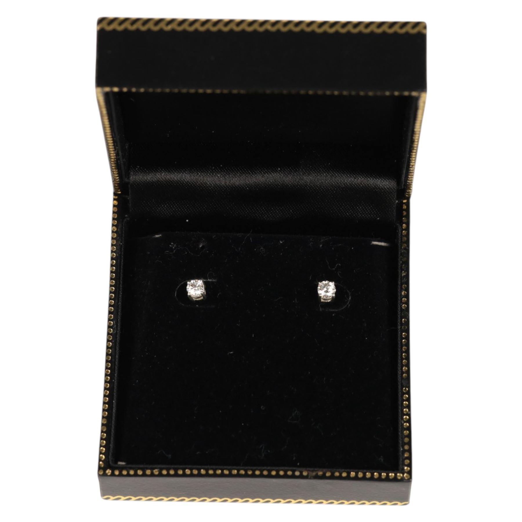 Pair of sliver diamond stud earrings, boxed