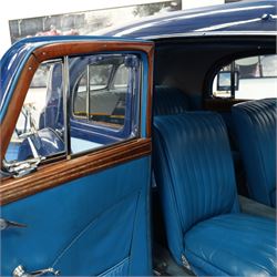 1939 MG SA Saloon

Registration: GRB 988
Chassis number: SA2983
Engine number: QPHG3242 (original engine)
Engine: 2,322cc six-cylinder petrol
Transmission: Manual
Odometer reading: 71,873 miles
Seating: Five
Colour: Two-tone blue
Former keepers: 6/7 recorded
V5C: Present
Keys: One

A 1939 MG SA Saloon, finished in an attractive two-tone blue colour scheme and retaining its original UK registration, GRB 988.

Introduced in 1936, the MG SA was the marque's prestigious sporting saloon, combining elegant coachwork with refined six-cylinder performance and luxurious accommodation. This example retains its original 2,322cc engine, numbered QPHG3242, and displays 71,873 miles on the odometer, although this mileage has not been independently verified.

The car is understood to have undergone an extensive rebuild and restoration between 2010 and 2015 and is today presented in showroom condition throughout. The coachwork has an excellent finish, complemented by outstanding chrome brightwork, wire wheels, a rear-mounted spare wheel, folding rear luggage rack and a desirable folding canvas sunroof. The engine bay is immaculately detailed, while the underside, chassis and suspension all reflect the high standard of restoration undertaken. A stainless-steel exhaust system has also been fitted.

The luxurious cabin features beautifully finished inlaid wood veneer, leather seating and period instrumentation, all presenting to an exceptionally high standard.

A particularly appealing aspect of this MG SA is its documented participation in the 1952 Daily Express National Motor Rally. Accompanying the vehicle are the original official rally programme together with period photographs showing the car competing in the event displaying entrant number 36. The programme lists entrant No. 36 in Class D.2 as an MG 2322cc, providing excellent documented provenance linking this car to one of Britain's best-known post-war motoring events, held between 12th and 15th November 1952.

Combining documented provenance with exceptional cosmetic presentation, this MG SA represents a rare opportunity to acquire one of MG's flagship pre-war sporting saloons.

At the time of cataloguing the vehicle started and ran well.

Features

• Original 2,322cc six-cylinder engine
• Manual transmission
• Original UK registration
• Two-tone blue coachwork
• Folding canvas sunroof
• Leather interior
• Inlaid wood veneer dashboard and trim
• Wire wheels
• Rear-mounted spare wheel
• Folding rear luggage rack
• Twin carburettors
• Stainless-steel exhaust system
• Extensive rebuild and restoration completed between 2010 and 2015

History and Documentation

• Approximately six to seven former keepers recorded
• Original engine (No. QPHG3242)
• Chassis No. SA2983
• Original UK registration
• Extensive rebuild and restoration completed between 2010 and 2015
• Original 1952 Daily Express National Motor Rally programme
• Period photographs showing the vehicle competing as Entrant No. 36
• V5C registration document not present
• One key

Condition

Presented in exceptional showroom condition, this MG SA has clearly benefited from a high-quality restoration completed to an impressive standard. The paintwork, chrome, interior, engine compartment and underside are all exceptionally well presented, reflecting the considerable work undertaken.

The vehicle started and ran well at the time of cataloguing. It has not been subjected to a full mechanical inspection by the auctioneers, and prospective purchasers should satisfy themselves as to the vehicle's condition, originality, mileage, specification and roadworthiness prior to bidding.

This vehicle forms part of the Estate of the late John Sills and is offered for sale by the Executors, providing a genuine reason for sale.