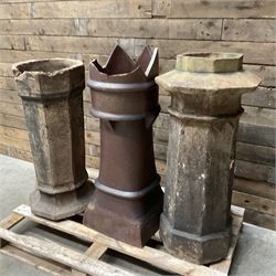 Collection of three Victorian and early 20th century reclaimed terracotta chimney pots, comprising: one cylindrical form with weathered, cracked glaze and flared octagonal base; one deep red cylindrical pot with fluted midsection and castellated rim, bearing moulded number ‘25’; and one tapering hexagonal example with wide flared rim and weathered patina. All with age-related wear and chips, consistent with use and outdoor exposure. Plus a selection of cast stone pieces including fountain 