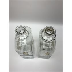 Pair of Georgian glass spirit decanters, of straight sided form with rounded shoulders, each side engraved with flowers and heightened with gilt, each approximately H20cm 