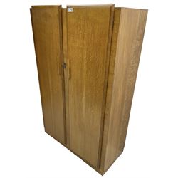 Early 20th century Art Deco period oak double wardrobe, the interior fitted with mirror, shelf and hanging rail