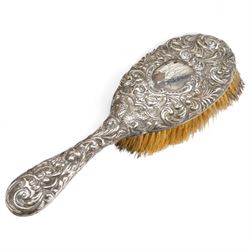 Ladies Edwardian crocodile travelling toilet case with watered silk interior containing six silver mounted glass jars Birmingham 1909 Maker Neal Bros. and a three piece dressing table set Sheffield 1898 W35cm