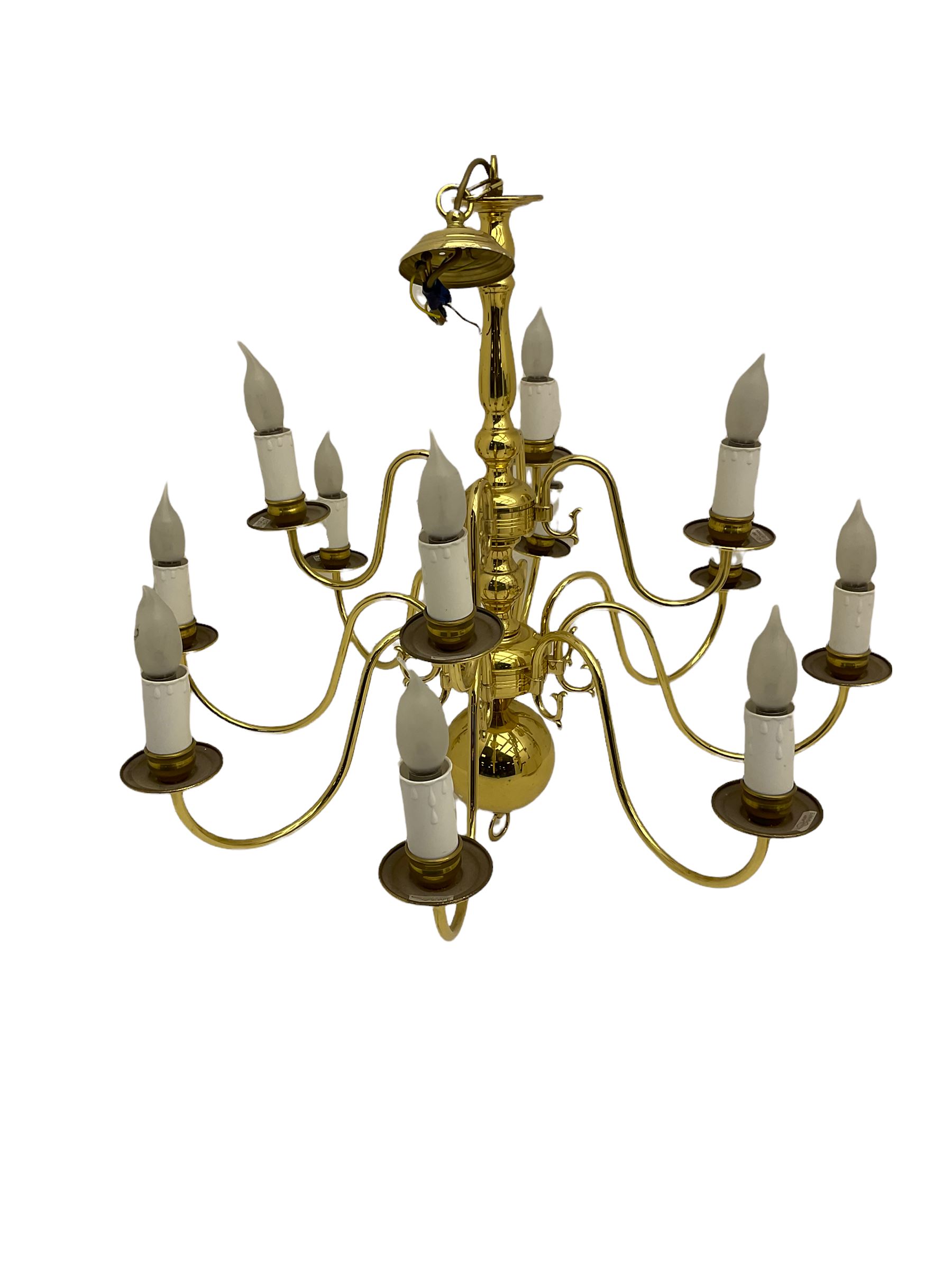 Brass twelve branch chandelier, heavy brass five branch chandelier and a modern light fitting (3)