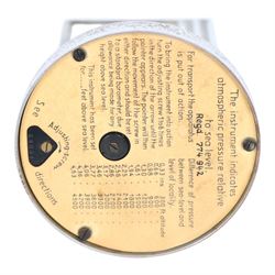 Art Deco chrome plated desk aneroid barometer by Zeiss Ikon, with frosted glass panel to rear, upon raised on a stepped circular base with instructions printed on the underside, H16cm