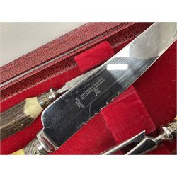 Silver plated Calibri lighter, in the form of a twin handled vase with mask handles, together with a pair of silver plated candle sticks, horn handled carving set with hallmarked silver ferrules and other silver plated items