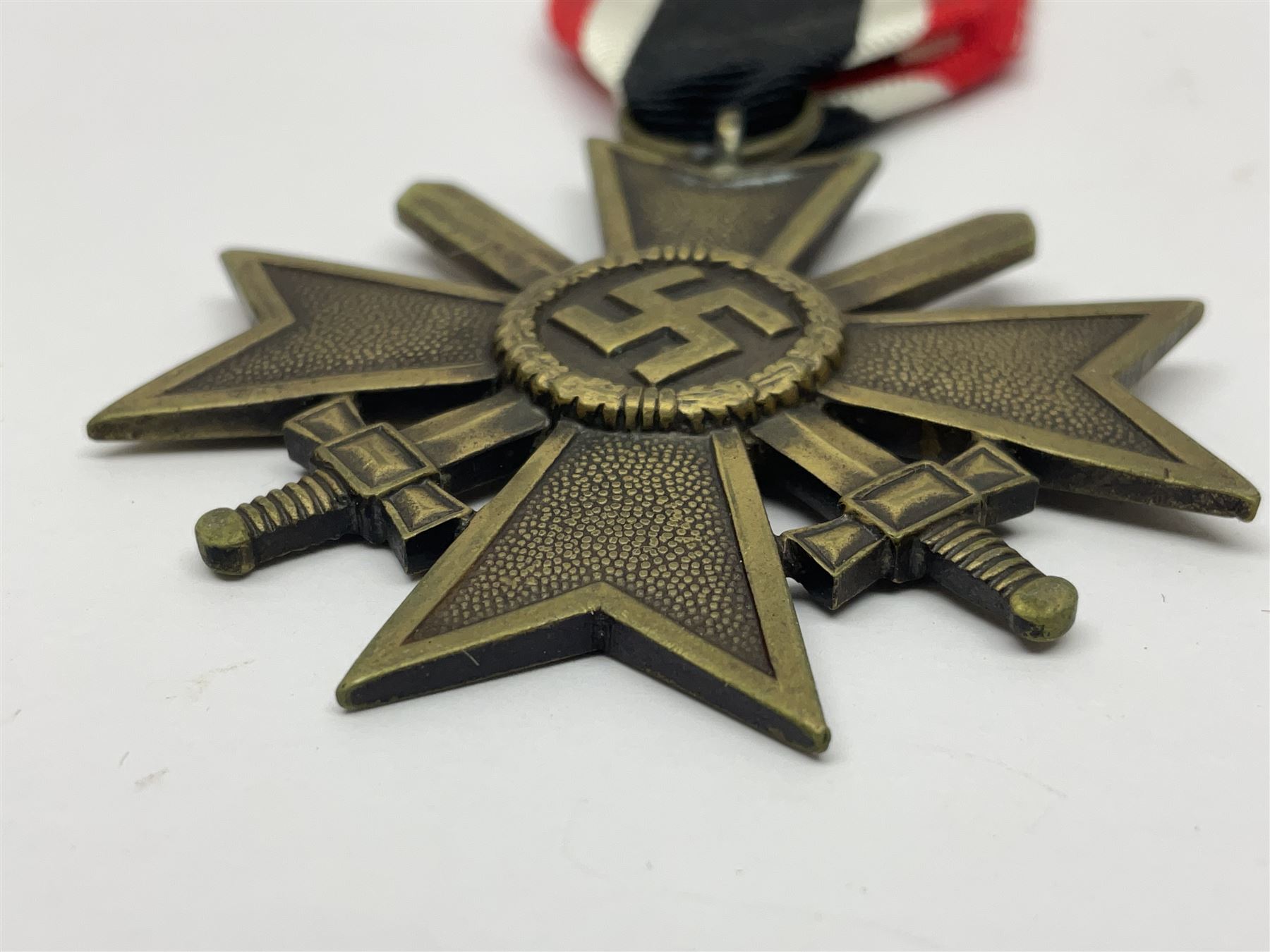WWII German 'SS' Long Service Medal for four years; Ostfront Medal for the Winter Campaign in Russia of 1941-1942 'Die Medaille Winterschlacht Im Osten'; and War Merit Cross 2nd Class with swords; all with ribbons (3)