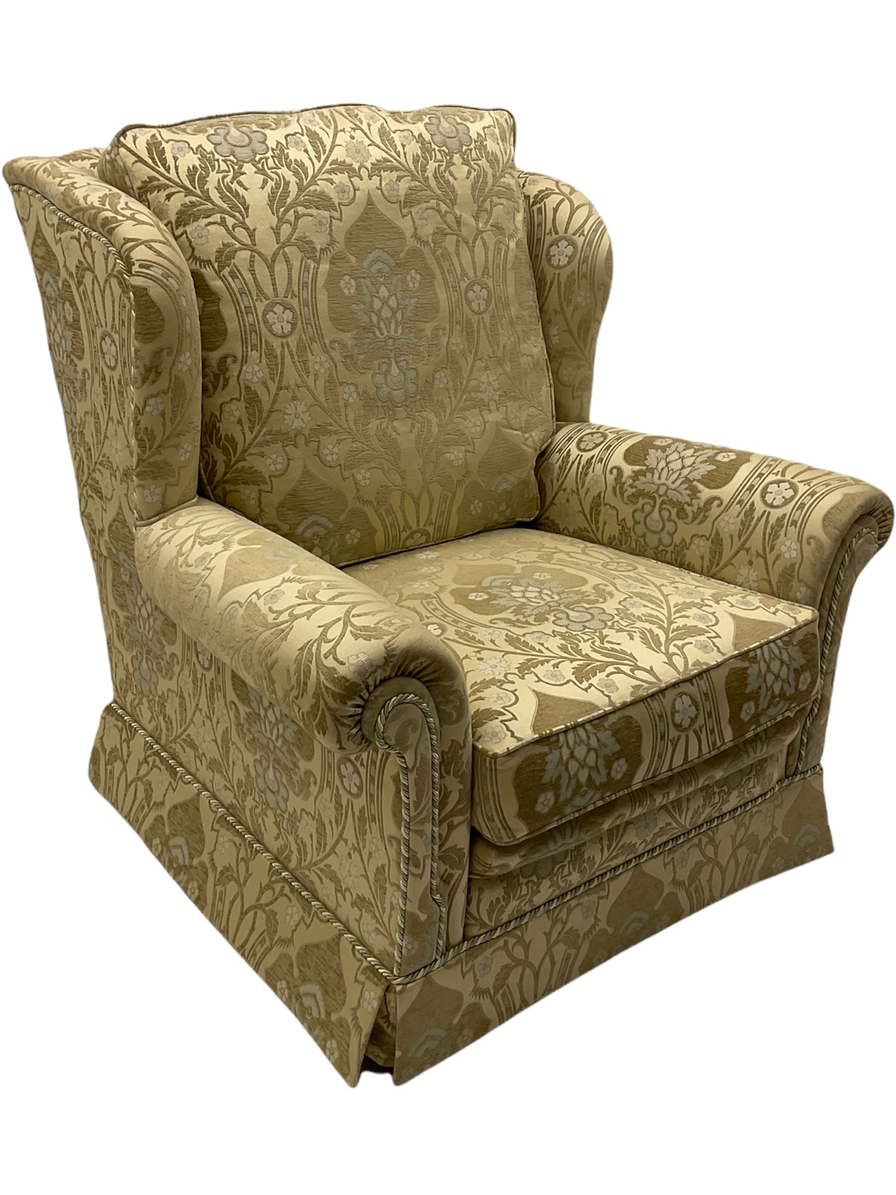 Steed Kedleston three seat sofa, and matching wing back armchair, upholstered in pale gold fabric