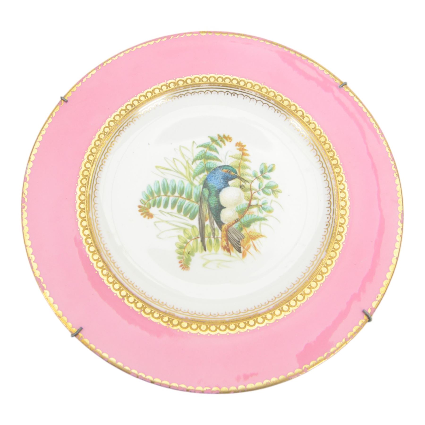Two 19th century Samson porcelain plates, decorated in the Chelsea style with exotic birds, flowers and insects, each with spurious gold anchor mark verso, largest example D24cm, together with a 19th century dessert plate, possibly Worcester, hand painted with a hummingbird, within a gilt band and pink border, D22.5cm, and a further 19th century dessert plate with shaped and pierced rim, hand painted with a view of Loch Lomond and titled verso, D22cm, (4)