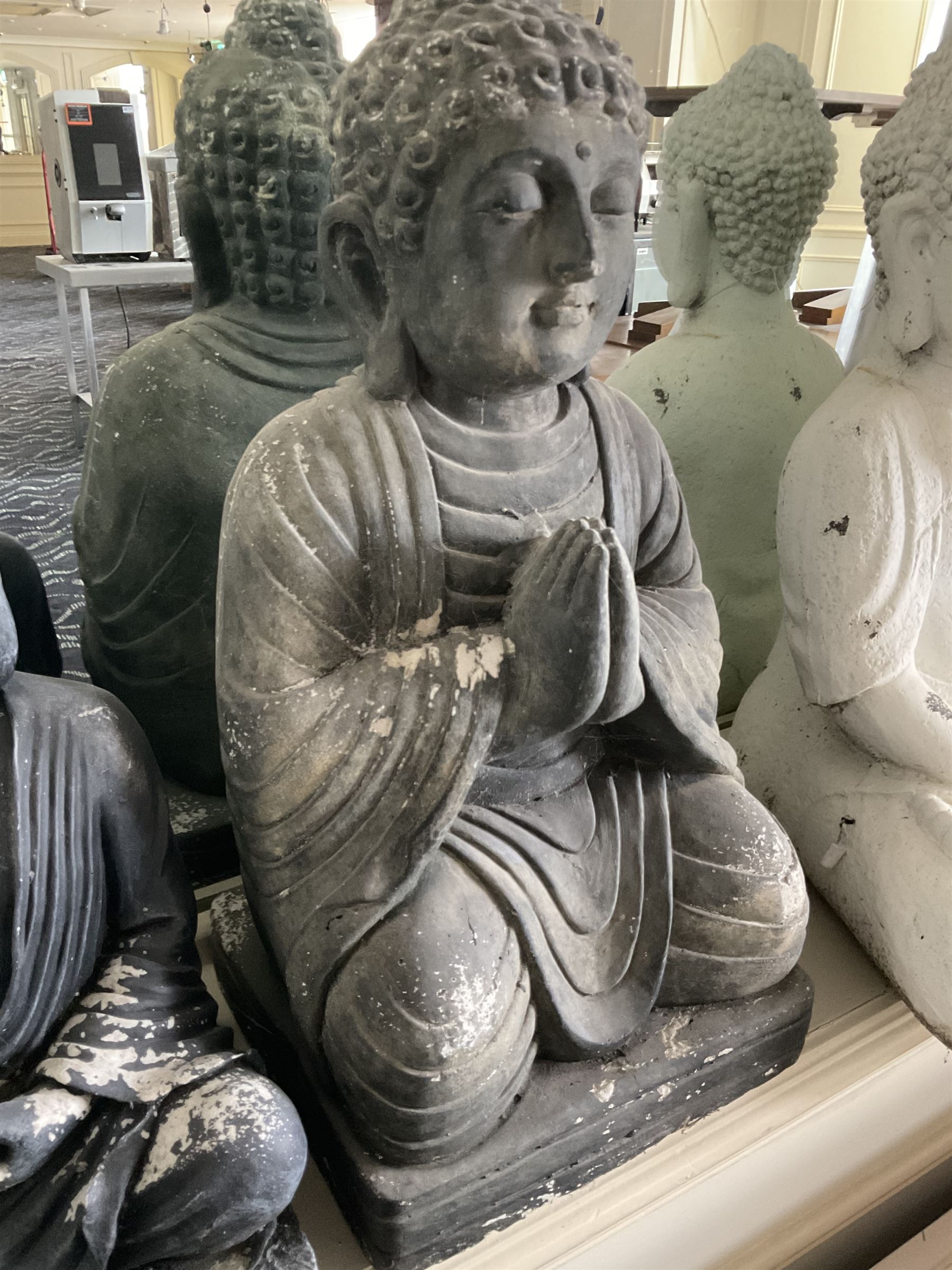 Three cast seated Buddhas and an elephant (4)- LOT SUBJECT TO VAT ON THE HAMMER PRICE - To be collected by appointment from The Ambassador Hotel, 36-38 Esplanade, Scarborough YO11 2AY. ALL GOODS MUST BE REMOVED BY WEDNESDAY 15TH JUNE.