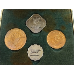 Bailiwick of Jersey 1957 cased four coin set and 1964 cased four coin set, Guernsey 1966 cased four coin set and New Zealand 1967 decimal coins cased seven coin set with coins still sealed in plastic packaging (4)   