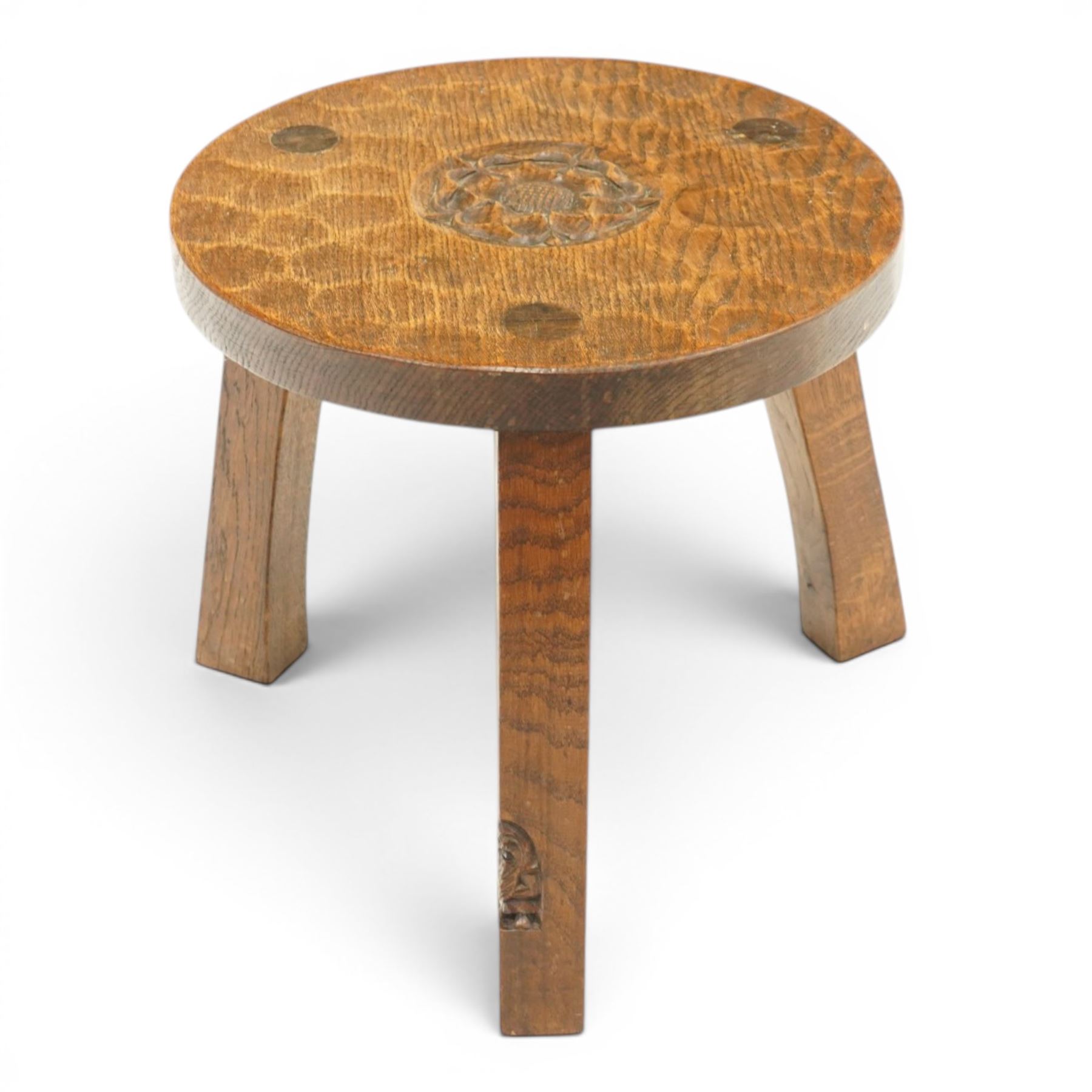 Gnomeman - circular adzed oak stool with carved Yorkshire Rose top, raised on three shaped supports carved with gnome signature, by Thomas Whittaker, Littlebeck, Whitby