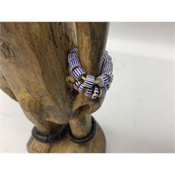 Early 20th century West African Yoruba family wooden figure of Orisha Oko, the god of farming/agriculture, carved from the solid, bears manuscript label of provenance verso H26.5cm