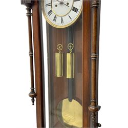 Lenzkirch – 8-day walnut cased weight driven Vienna regulator manufactured 1877-1878, with a break-arch pediment surmounted by a turned finial on a raised cavetto molding, fully glazed arched  door flanked by long ring turned pendants, flat base with open fretwork and two short pendants,  two piece enamel dial within a brass slip, Roman numerals, minute track and pierced steel hands, wooden pendulum with a brass faced bob, two brass cased weights and pulleys, dead beat escapement with a rack striking movement sounding the hours and half hours on a coiled gong, movement serial number 421410. 
Lenzkirch were one of Germanys most highly respected clock manufacturers of the 19th century, founded in the late 1850s the company produced movements and cases of high quality up until 1932.
