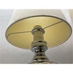 Pair of chrome table lamps, with cream lampshades, H79cm 