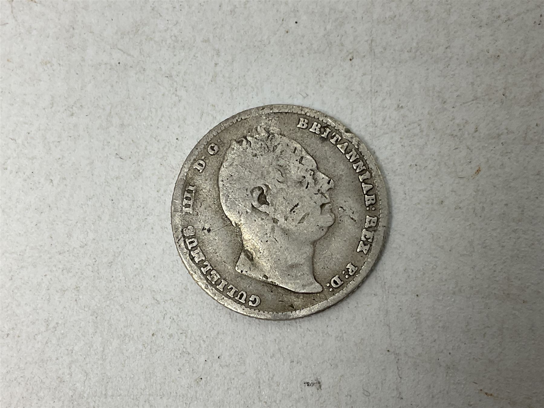 Approximately 120 grams of Great British pre 1920 silver coins, including George III 1819 half crown, William IIII 1834 shilling, Queen Victoria 1892 half crown, various silver threepence pieces etc