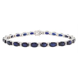18ct white gold sapphire and diamond bracelet, twenty-three oval cut sapphires, each spaced by two round brilliant cut diamonds, stamped 750, total sapphire weight 14.785 carat, total diamond weight 0.88 carat
