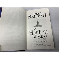 Collection of twenty-three hardback Terry Pratchett books, comprising approximately eighteen first editions including The Fifth Elephant signed & inscribed by Pratchett, all with dustjackets