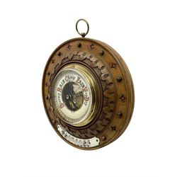 German- Late 19th century aneroid Barometer in a carved mahogany case with pendants and finials, 4” open dial register and mercury thermometer, with another early Edwardian aneroid barometer in a circular carved  walnut case with a 4