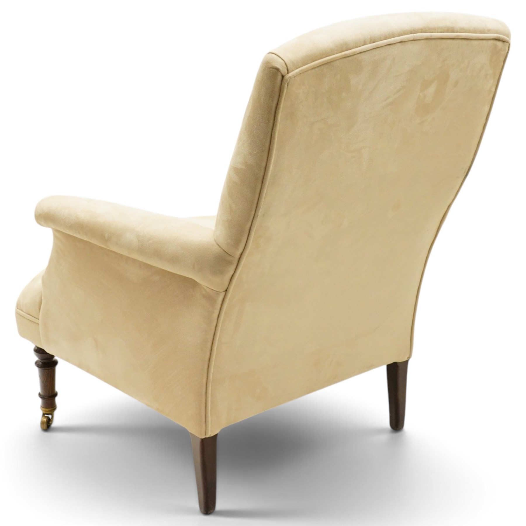 Sofas & Stuff - pair of ‘Thistle’ armchairs upholstered in neutral fabric, each with gently sloping back, padded scroll arms with close-set stud detailing, loose seat cushions, raised on turned wooden legs with brass castors