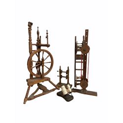 Early 20th century turned ash and beech spinning wheel, together with yarn winders, flyer shaft etc (5)