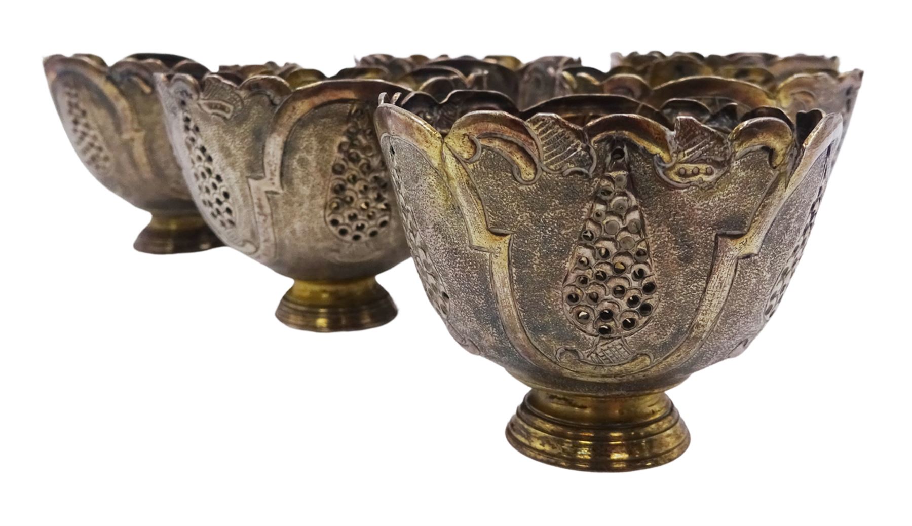 Set of six Ottoman Turkish silver zarfs or coffee cup holders, probably 19th century, the bowls with shaped rims and embossed and pierced decoration, upon stepped circular feet, D6cm H5cm