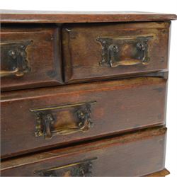 Table top chest of drawers, of rectangular form, with two short and two long drawers, raised upon bun feet, H22cm