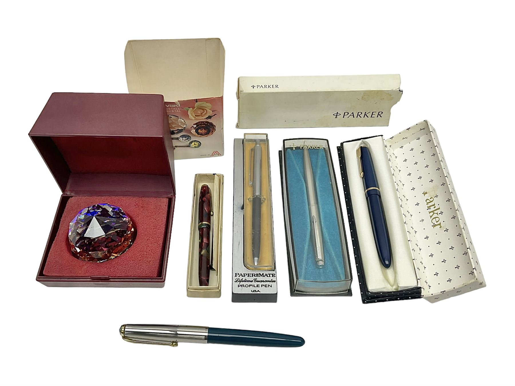 Three fountain pens, to include Conway Stewart 'Dinkie 550' and 'Conway 57' and a Parker 'Slimfold', all with 14ct gold nibs, together two roller ball pens, including a Parker example and a Swarovski Crystal paperweight