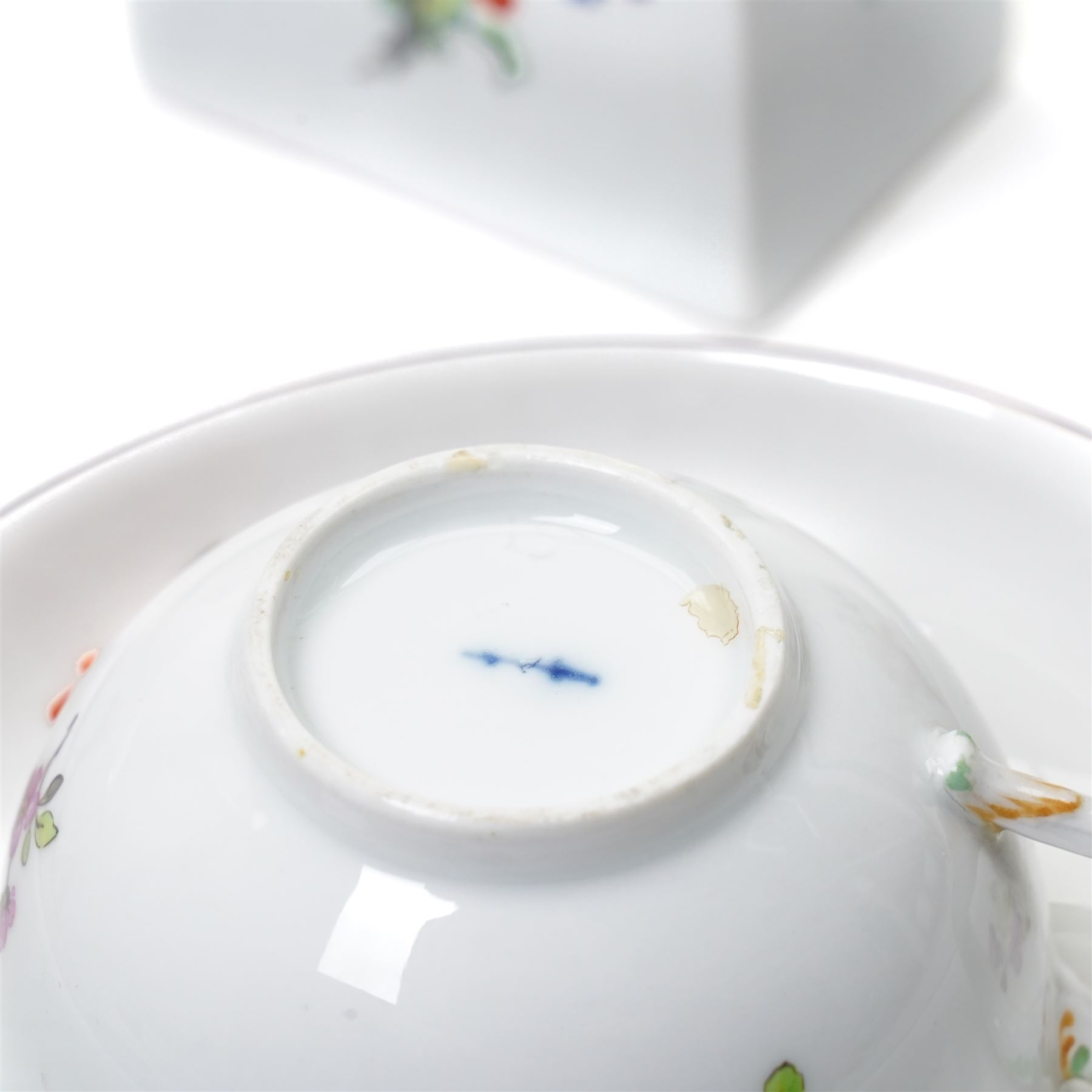 18th century Berlin part tea and coffee service circa 1780 painted with sprays of Spring flowers comprising four tea cups, five coffee cups,  six saucers, tea pot, tea caddy and sucrier and cover  