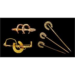 Three Victorian and Edwardian horseshoe stickpins, one dimaond set, one paste stone set, the other pearl set and two gold horseshoe brooches