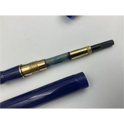 Parker Duofold fountain pen, the blue barrel and capwith gilt banding and clip, and gold bi-colour nib stamped 18K 750, together with a matching ball pen and Parker Duofold mechanical pencil with grey pearl and black marble style barrel, both in boxes (3)