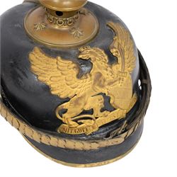 WWI Prussian Pickelhaube, Baden Infantry Regiment, the black leather skull with detachable brass spike, the circular base plate set with four star retaining studs, brass eagle helmet plate, both sides with red and black cockades