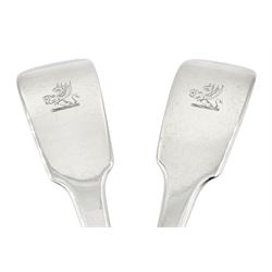 Pair of William IV silver Fiddle pattern basting spoons with engraved crest to terminals, hallmarked Jonathan Hayne, London 1834, approximate total weight 7.90 ozt (246 grams)