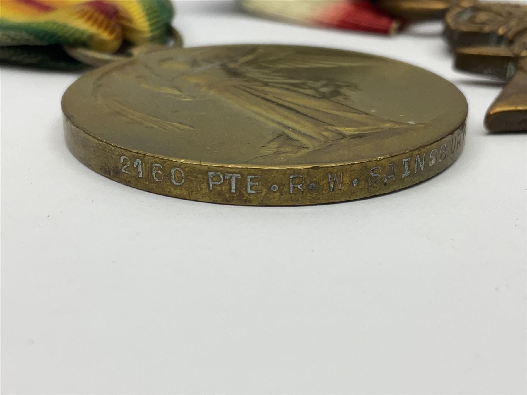 WWI RAMC Military Medal group of four comprising MM awarded to 439278 Pte. R.W. Sainsbury 1/3 S.M.F.A. R.A.M.C. T.F., British War Medal, Victory Medal and 1914-15 Star awarded to 2160 Pte. R.W. Sainsbury R.A.M.C.; all with ribbons; together with RAMC shoulder title
